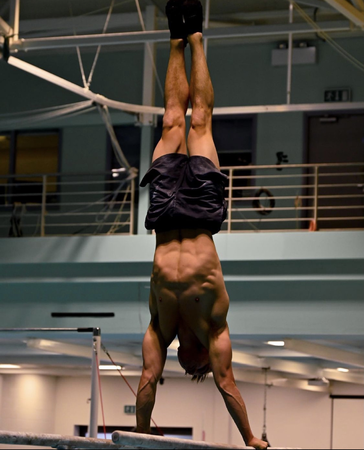 Maxwell Robertson performing a handstand